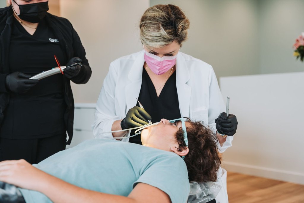 Digital iTero scan being performed on a visitor at Cape Fear Orthodontics