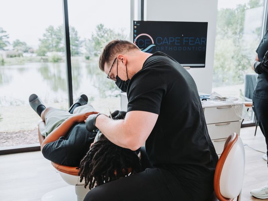 Dr. Justin Groody providing chairside treatment at Cape Fear Orthodontics